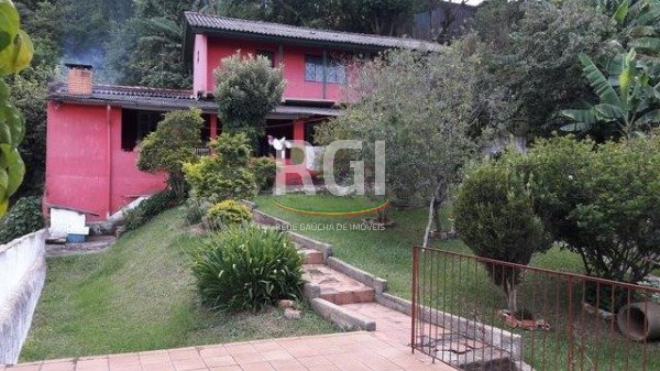 Casa com 136m², 3 dormitórios, 2 vagas no bairro Santa Isabel em Viamão para Comprar